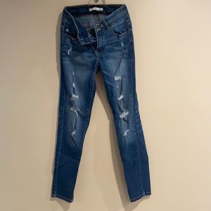Torn up skinny stretchy jeans
